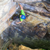 Jean-Christophe Fillion-Robin approaching the big roof system on Four Sheets To The Wind (5.9+) at Junkyard Wall. Photo by Jeff Dunbar.