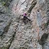 Kate nearing the mid-way ledge on Never Stop Exploring.