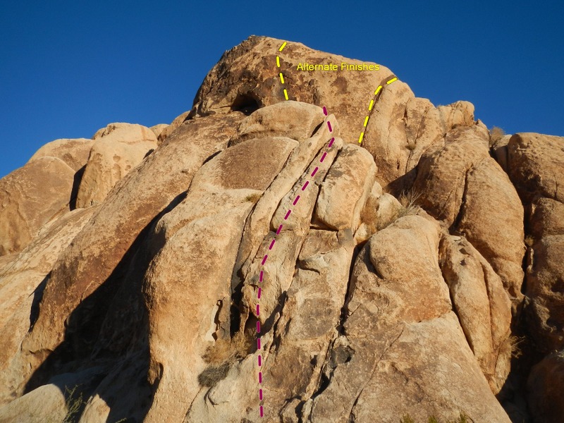 Climb the cracks any way you want and finish up with fractured face climbing on unprotectable terrain or harder cracks to the right.