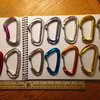 top from left: petzl spirit (old style), BD oz hoodwire, BD oz, trango superfly, BD neutrino, mammut moses. bottom from left: madrock superlight (?), WC helium, WC xenon, trango phase, CAMP orbit, CAMP photon, CAMP nano wire