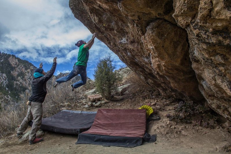 Sticking the crux toss!  Really exciting, dynamic move.  So fun! 