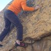 Crux move, using small holds. 