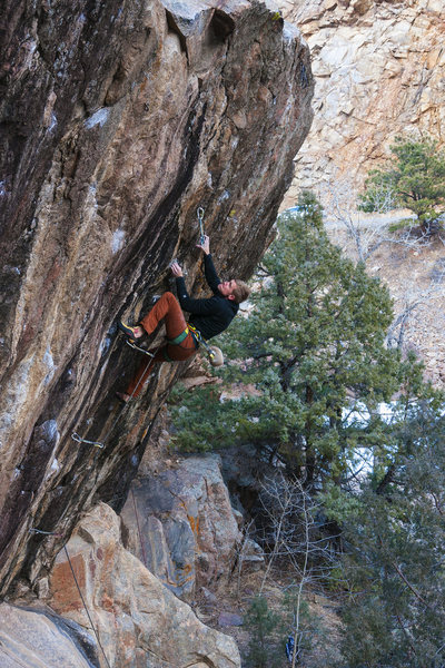 Spencer working the upper crux.