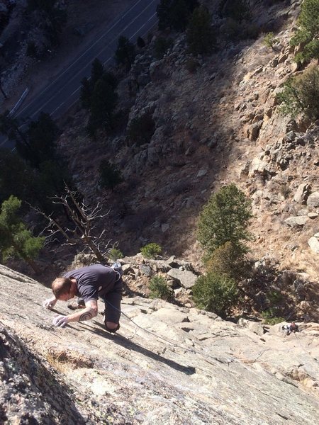 Getting to the last clip on Upside the Cranium. Stellar face climb in the St.Vrain. 