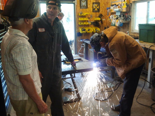 James, Mike and Kris making the sign. Safety first.