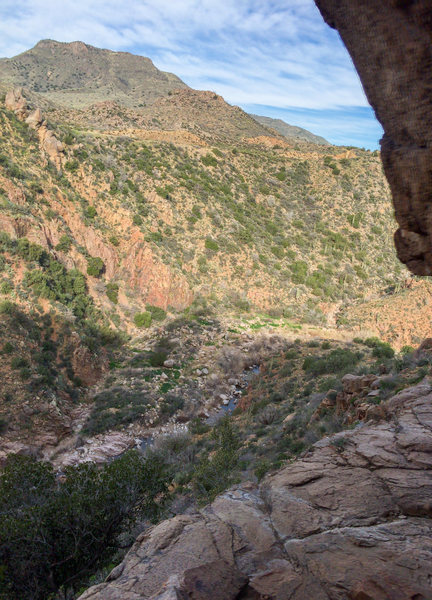 A view from the wall of the approach gully and hike from the highway.  See the route description for more details. 