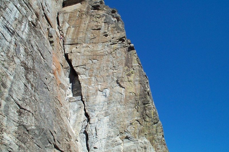 Climber nearing the top of the Dihedral.  I've never climbed this with anyone who thought it was less than solid 5.9.  They often wanted to add an "R" rating due to the difficulty of protecting the wide cracks at the top.