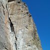 Climber nearing the top of the Dihedral.  I've never climbed this with anyone who thought it was less than solid 5.9.  They often wanted to add an "R" rating due to the difficulty of protecting the wide cracks at the top.