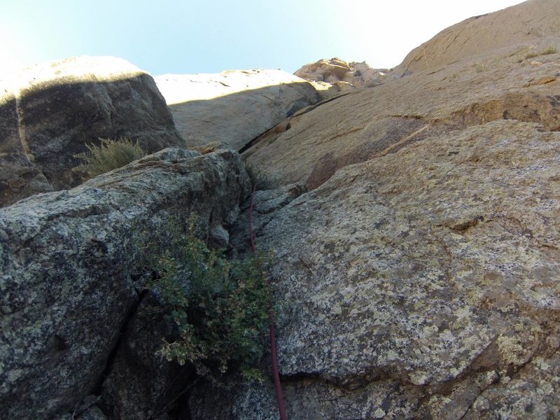 BETA! Do not climb the huge dihedral! Route finding is tricky. There should be a horn slung with old webbing, that is where you should build a belay for the traverse. allow plenty of time for the approach, as it is at the opposite side of the wall from the gully.