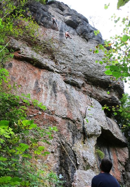 The right side of Puttlacher Wand, with climbers on Project KB and Intesivstation.  Station 53 begins up the same starting flake as Project KB, but then goes straight up from the flake to climb a few feet right of the blue rope.