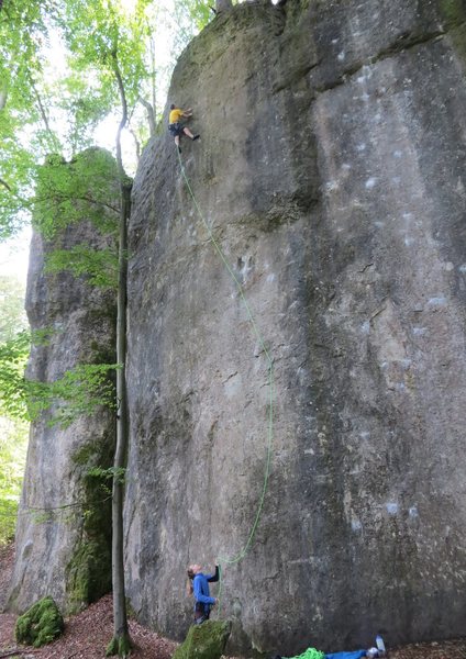 Deeper incut pockets begin to appear as you approach the top of the wall.