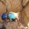 Gaining the chockstone at the top of pitch 2.