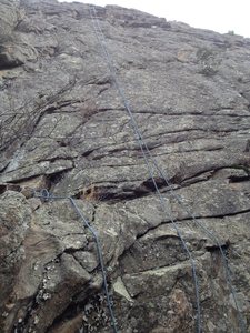 The route. A rope is hanging from the anchor.