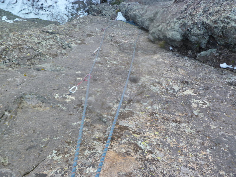 Looking down at the crux slab of the first pitch.