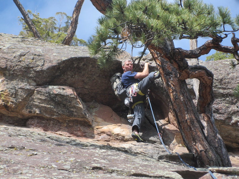 The roof crux. Best to ease over onto the east face, instead of going straight up over the roof.