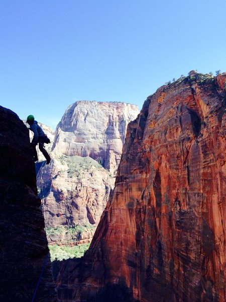 Josie McKee airing it out to the summit of Minotaur Tower via the Megamahedral. NE Face of Angels Landing behind, and the NW Face of Great White Throne in the way back