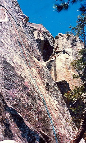 Unknown climber in the cruxy area of the second pitch, 1987.