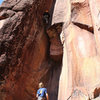 Dane Schellenberg above the roof and into the thin crack sequence on Wing and a Prayer Project