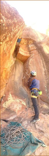 Nico Caceres climbs up into the sun on the crux of Wing and a Prayer Project.