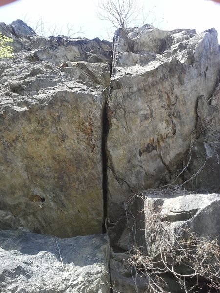 The crux roof move near the base of the crack.