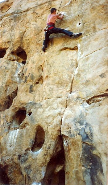 Peter Hayes moving into the crux sequence at 3/4 height. ca. 1988.