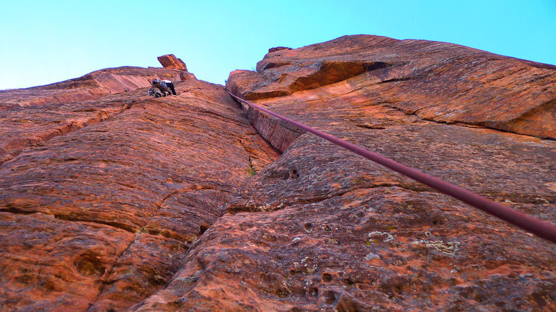 The rope is on Handy [5.9]. Climber to the left is on Just Another Jam, with which it shares an anchor.