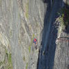 Looking down at the very exposed traverse on pitch 2