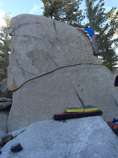 Justin on the right arete of the White Face Boulder.