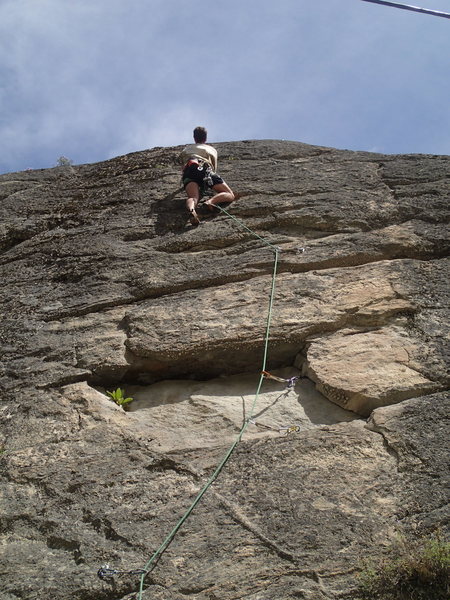 Climber eyeing the crux