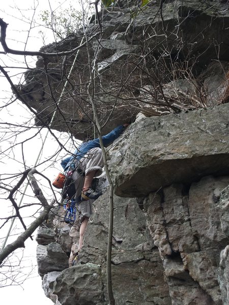 coming over a slightly over hung section there are easy holds to the anchors for this short climb