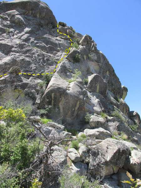 Most of the summit pitch as viewed from the saddle between the Wedge and it's false summit to the east. Above the belay marked, the scrambling gets easier and you may not wish to rope up. Going under the large boulder near the top saves you some exposure.