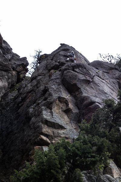 The line goes up past 2 bolts on the arête, then place a small cam or two in the flake, which I found to be the crux (a high reach) then continue up the arête past 2 more bolts.