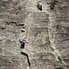 Finishing the first pitch.  Note the anchor up high in the crack, rather than the flake.