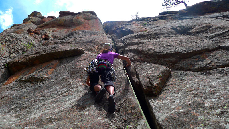 A climber starting up The Hallway, a great little trad line.