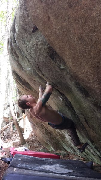 Sean Gilman on the right hand gaston (first move from the start). Getting ready to shoot for the good hold at the lip.