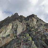 Typical climbing along the crest. At the top left you can see the red gully that marks the end of the route.