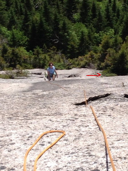 Sheila on our 1st pitch.  Arrow points to where we started after 3 x 115ft raps, about 1/2 pitch above the actual base which we could have reached easily with another rap.