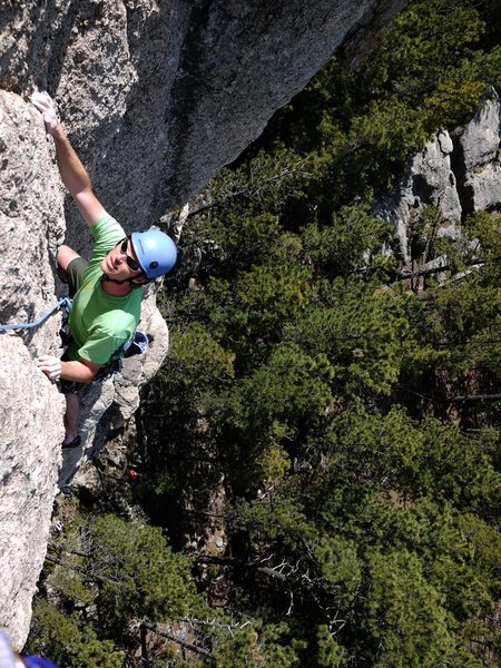 Jay coming up to belay station after first pitch.  