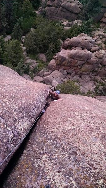 Damien past the crux on the first pitch.