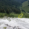From belay station of first pitch. Rocky area highlighted shows the part of the approach after coming out of the brushy tunnel.