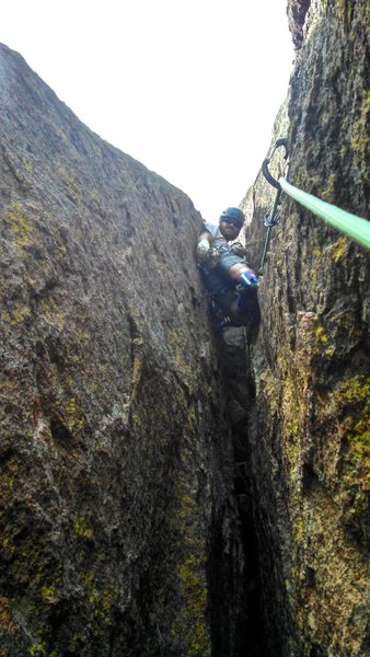 Matt, deep in the chimney on pitch 4 (notice cam placements to the right of chimney).