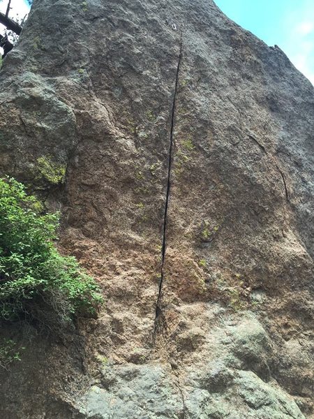 This is a 25 foot finger (to smaller than finger) crack with a piton 3 feet from 2 newly drilled bolts with hangers.   It is located about a mile up the trail on the north side, facing west.