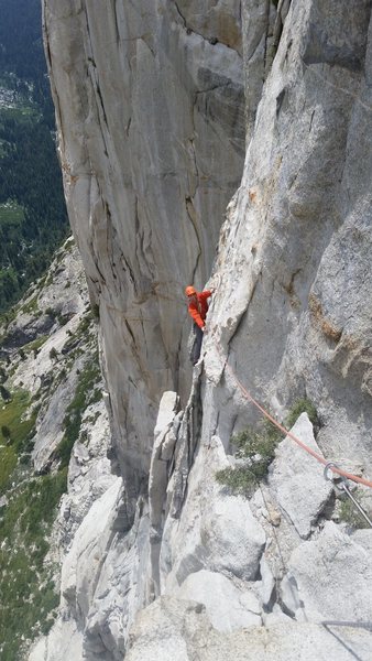 Vitaliy following the exposed traverse on P11