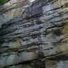 Looking up from the bottom. The route has bolts protecting the areas before and after the crack.