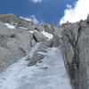 the upper ice pitch can be avoided by crossing the rocks to the right and accessing the upper snow face