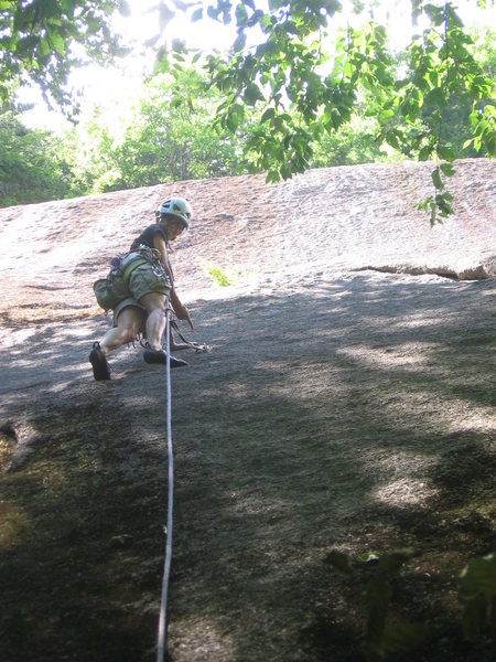 Annie pointing to the first bolt as she leads up P1 of Girls Prefer Batteries