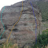 South face: the route in light blue is my downclimb on the southwest corner, the route in orange is likely the 5.7 crack, the dark blue is Southeast Corner, V1, & the black route is Interstate Contemplate, V3, on the east face.