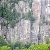 Falconer climbs the long crack on the buttress in the center of this photo. Goes up and left through the tree ledge, and then pulls the left side of the roof.