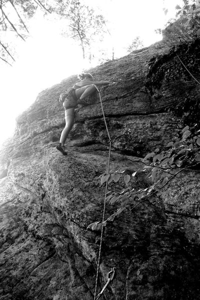 Torie demonstrates the high step crux of the route... we weren't sure if this move might be 5.7 so please climb it and chime in.