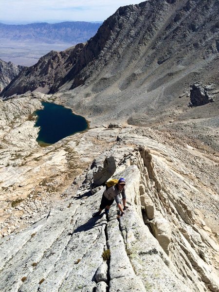 Chris Orozco enjoying the knife-edge exposure on Carl Heller's East Arete